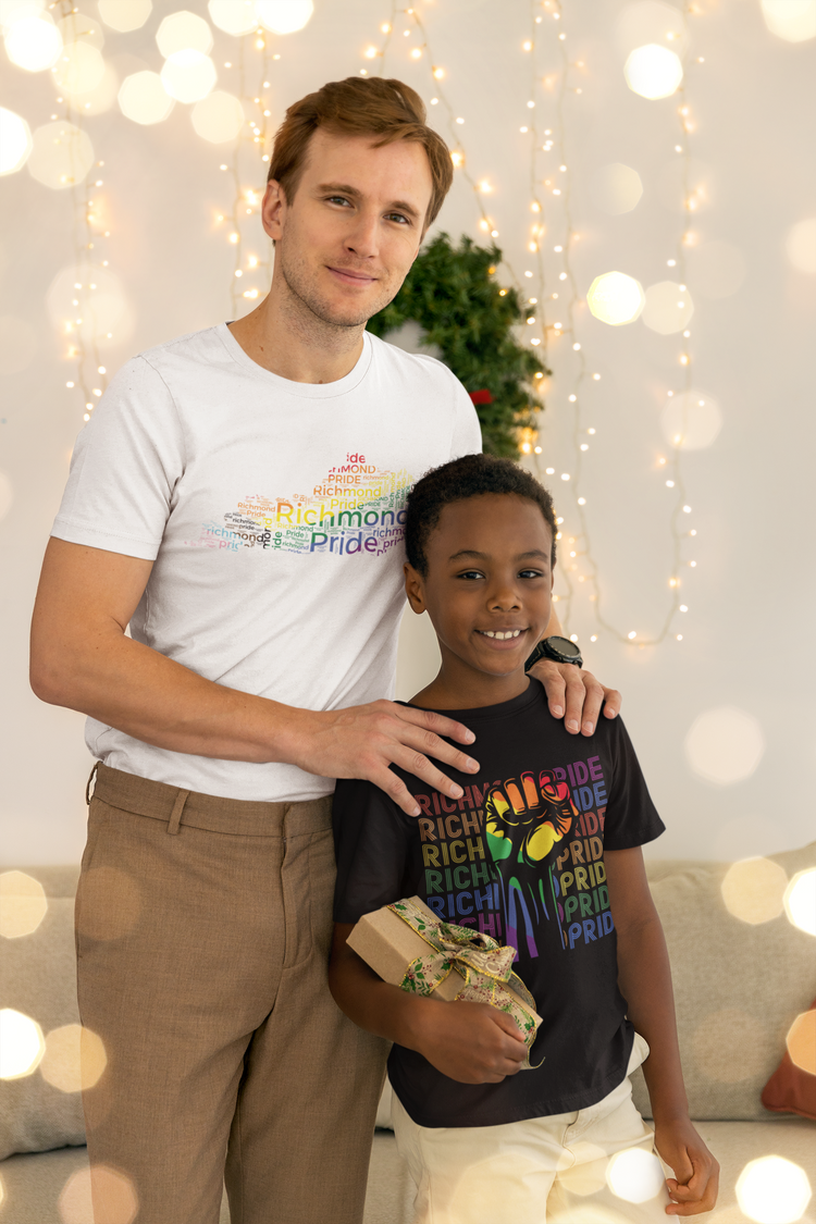 Father and son posing. Father is  while wearing white Richmond Pride t-shirt in the shape of Kentucky with rainbow words of "Richmond Pride" inside. Son is wearing black Richmond Pride shirt with a rainbow fist held in the air.